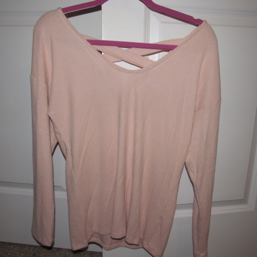 Light pink top with criss cross on the back